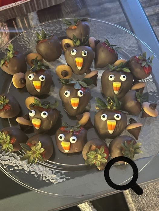 Charming dessert table setup featuring personalized cake pops and a tiered cake, perfect for celebrations.
