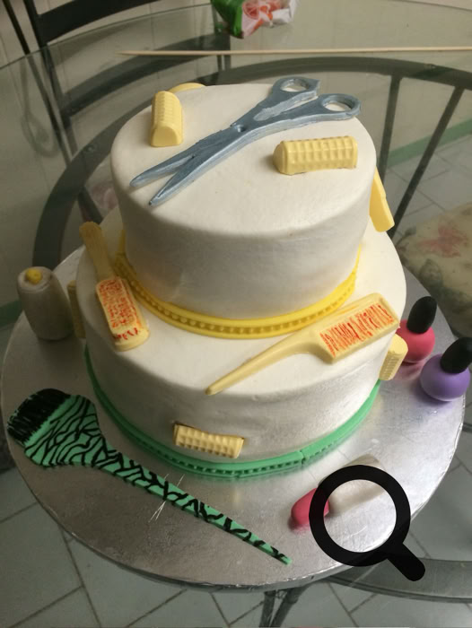Charming dessert table setup featuring personalized cake pops and a tiered cake, perfect for celebrations.